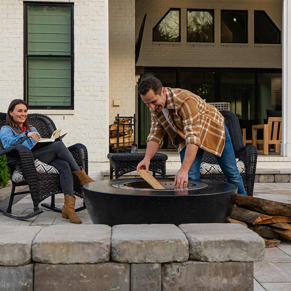 GFRC wood fire bowl with smokeless stainless insert on stone patio