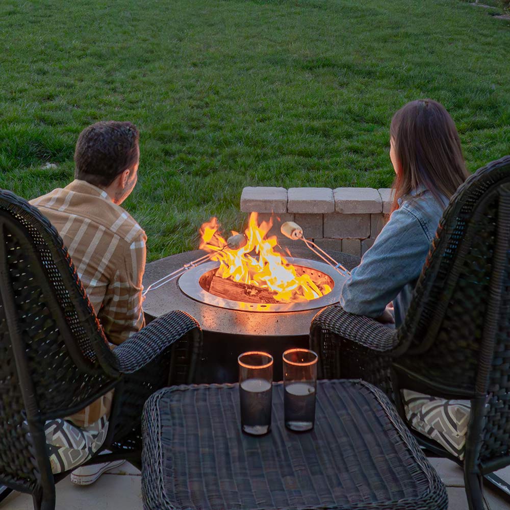Smokeless wood fire bowl with stainless insert, visible flames
