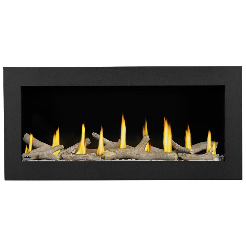 Gas fireplace with multiple yellow flames and beige log pieces in a black frame