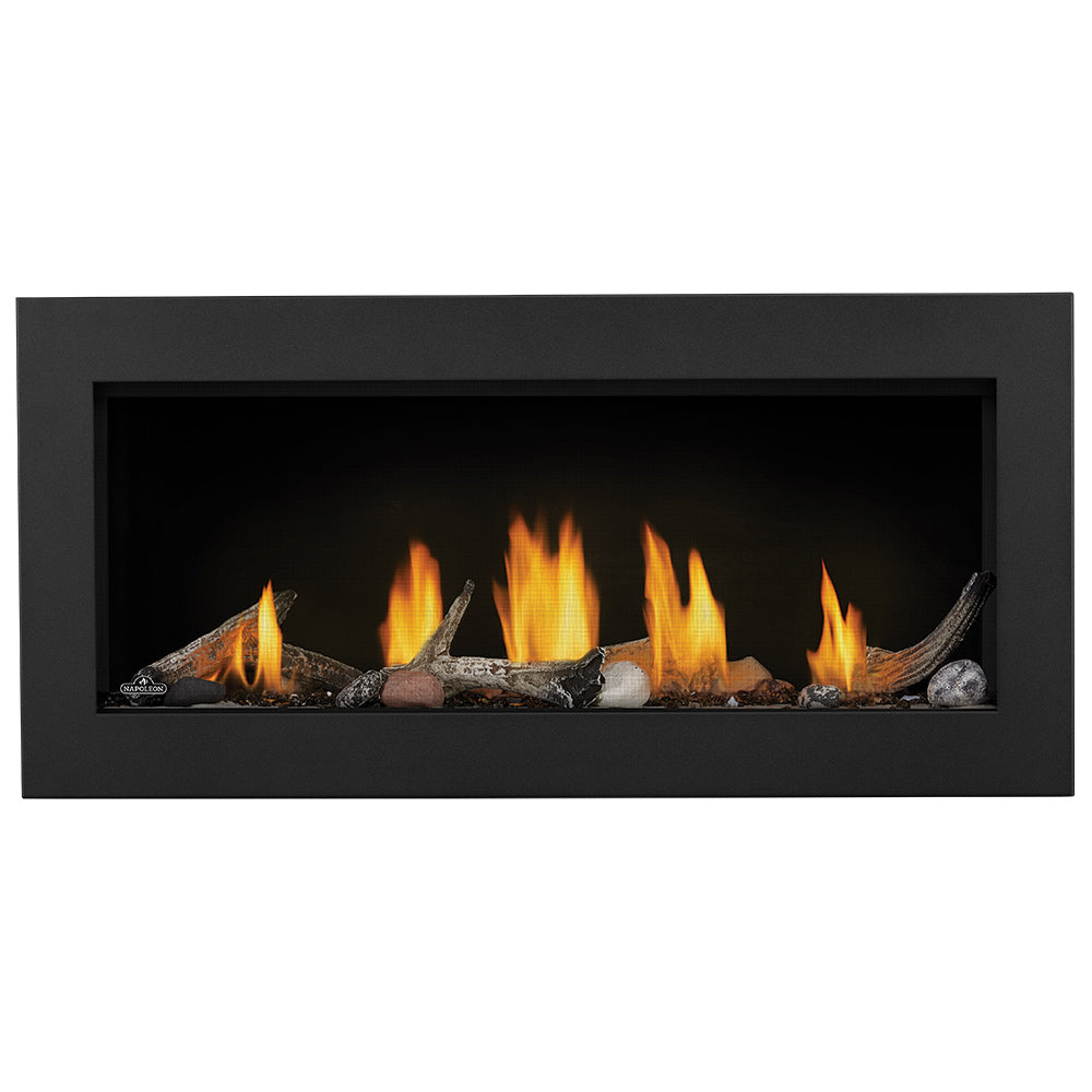 Direct vent gas fireplace insert with black surround, burning logs and embers