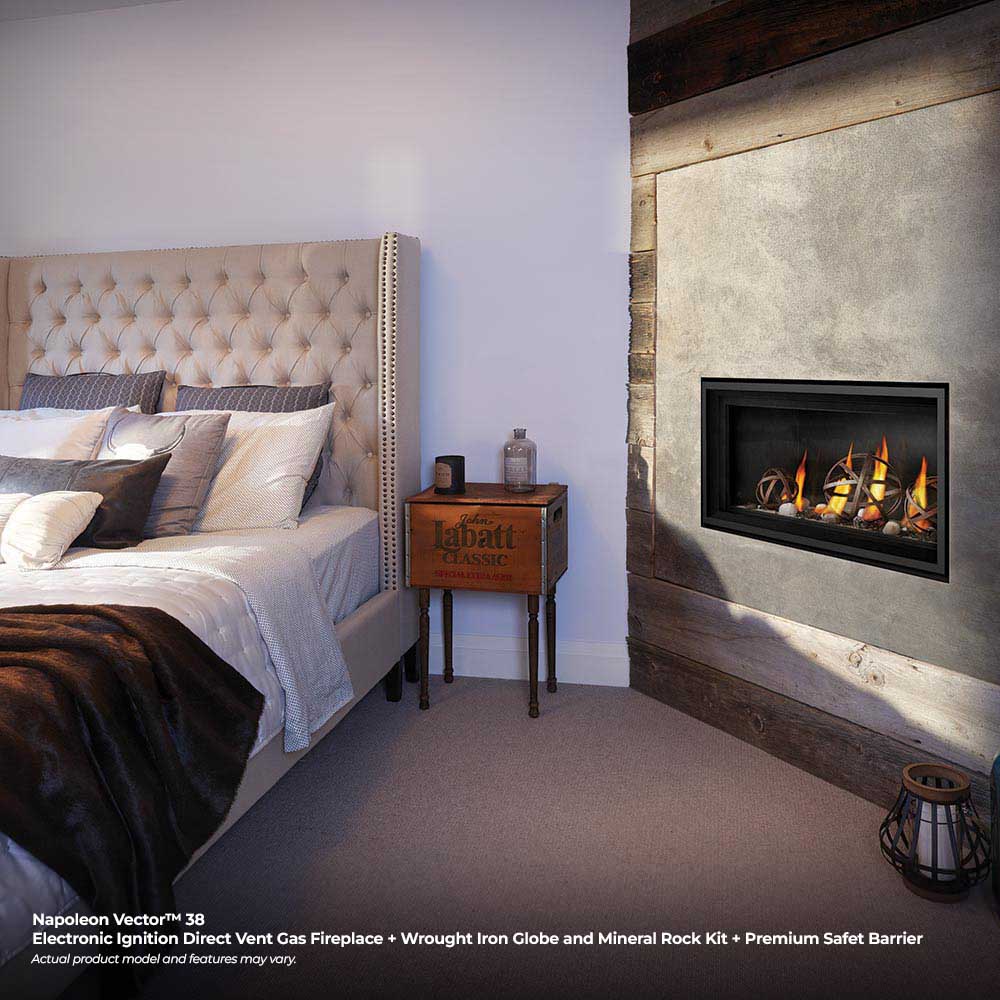 Direct vent gas fireplace insert with black trim, burning logs and ember bed