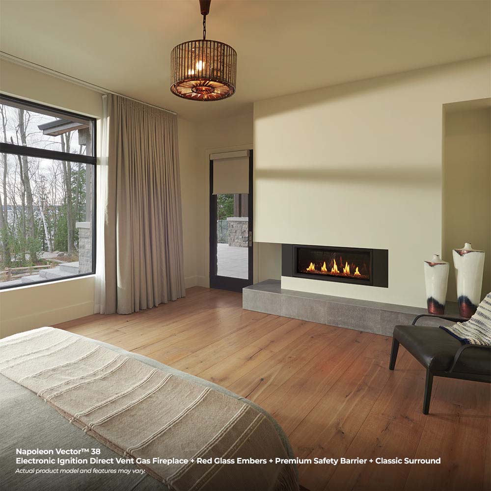 Wall-mounted direct vent gas fireplace with black frame and burning log bed