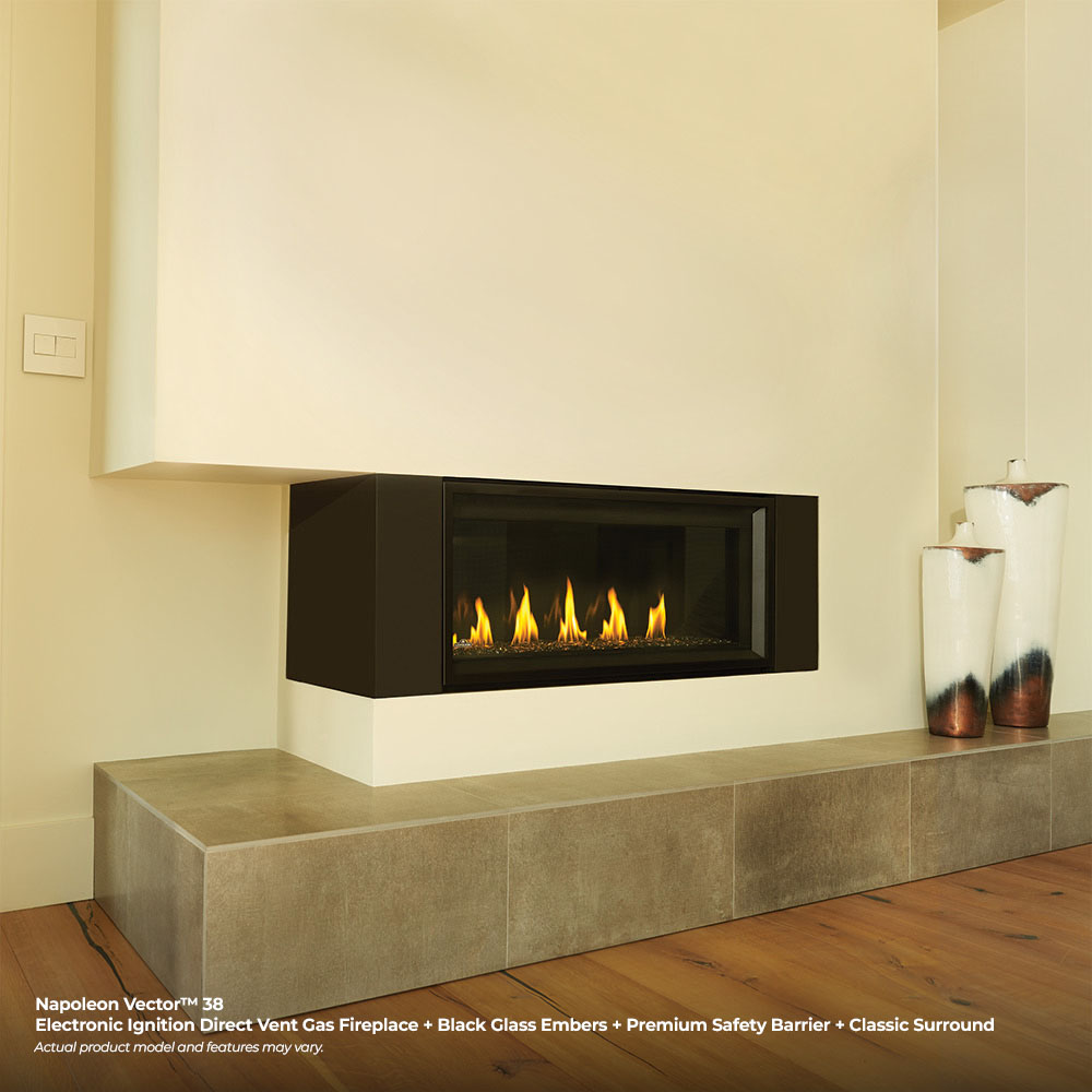 Built-in direct vent gas fireplace with black frame and burning log bed