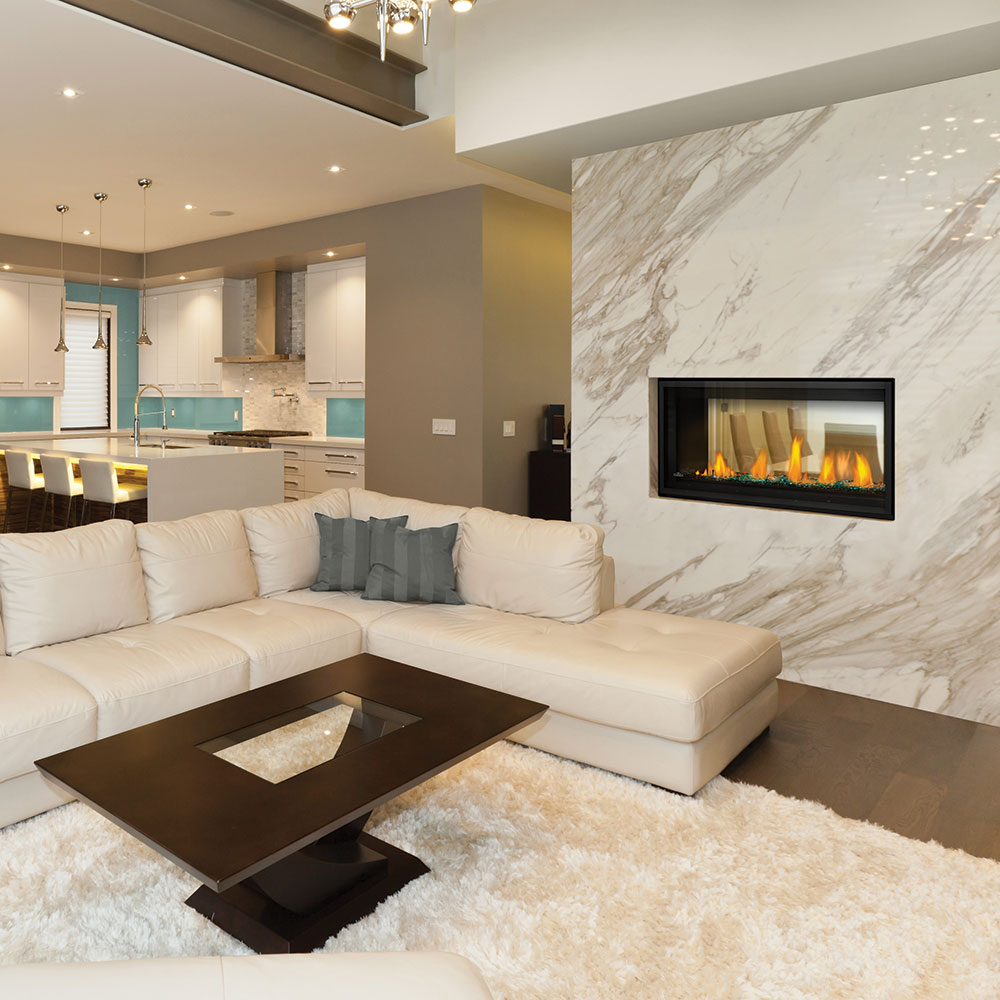 Wall-mounted gas fireplace with visible flames behind a glass front in a living room