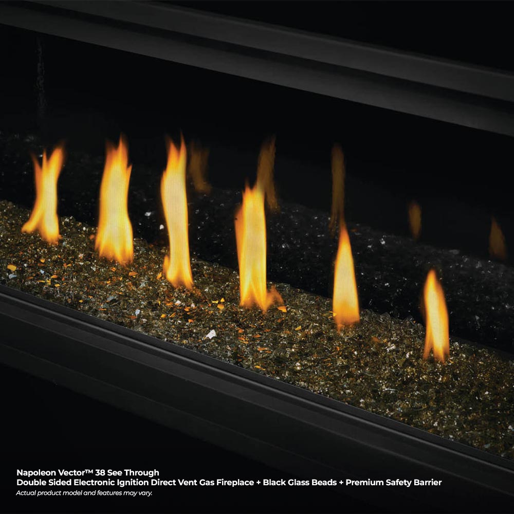 Gas fireplace with black glass beads and bright flames in dark firebox