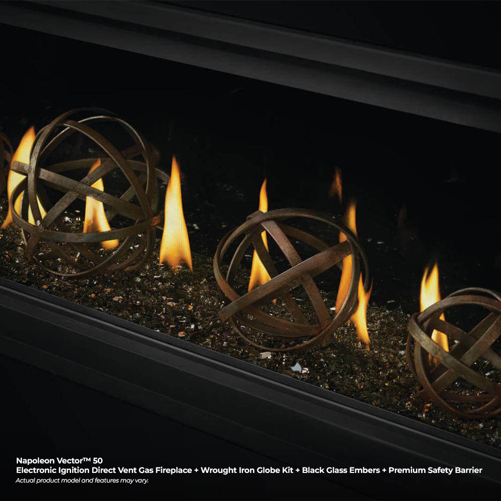 Direct vent gas fireplace with flames around dark fire media and wrought iron globe decor.