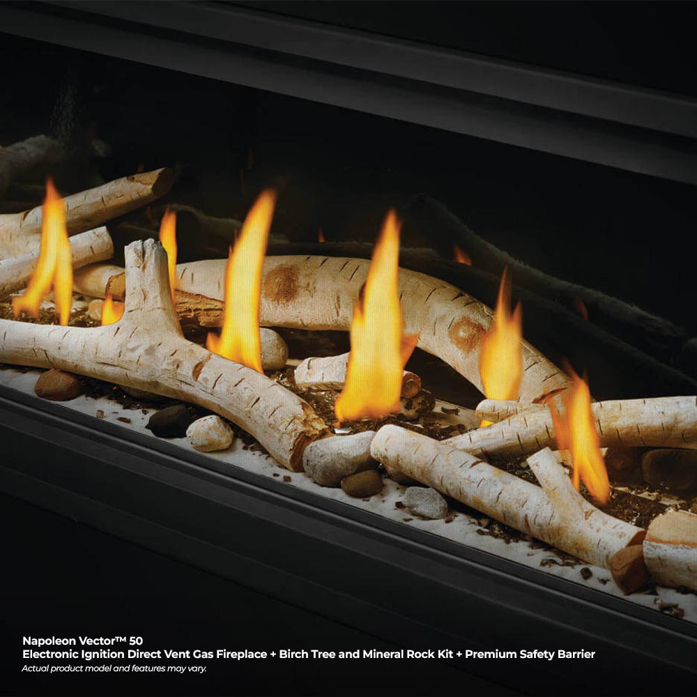 Direct vent gas fireplace with birch-like logs glowing with flames over light fire media.