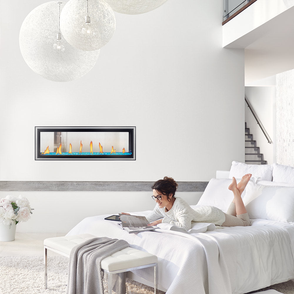 Wall-mounted double-sided gas fireplace with a black frame and visible yellow flames