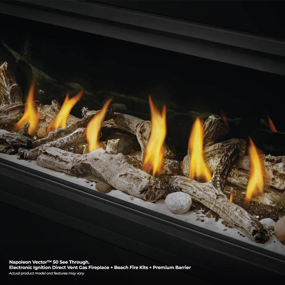 Direct vent gas fireplace with bright flames over faux driftwood and stones