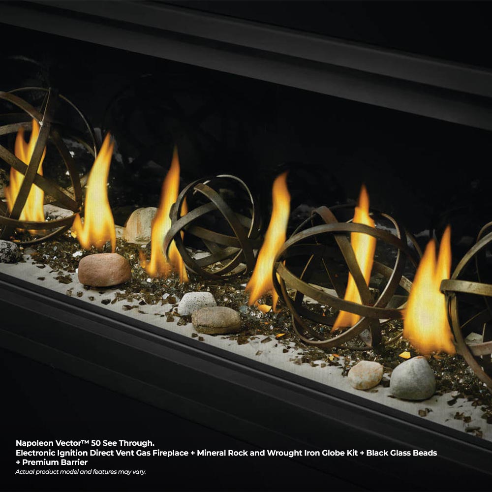 Direct vent gas fireplace with flames and metal ring ornaments over gravel