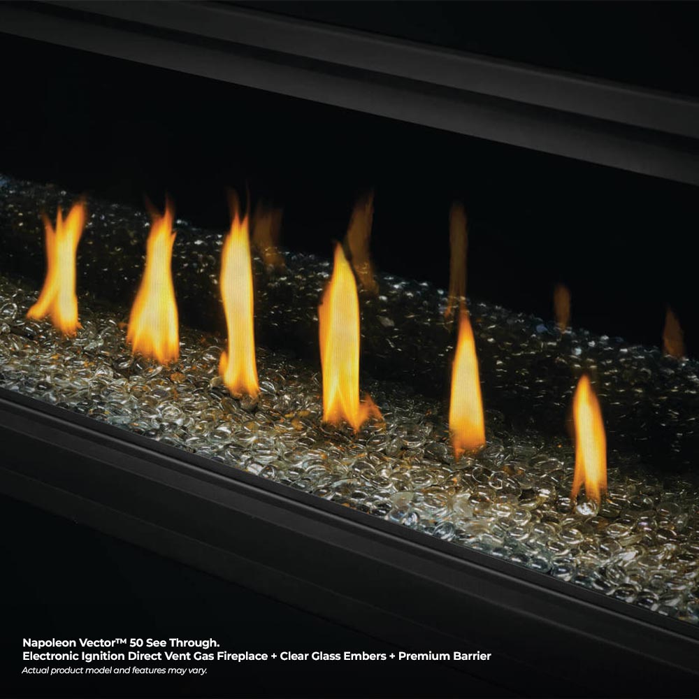 Direct vent gas fireplace with flames over dark glass ember bed
