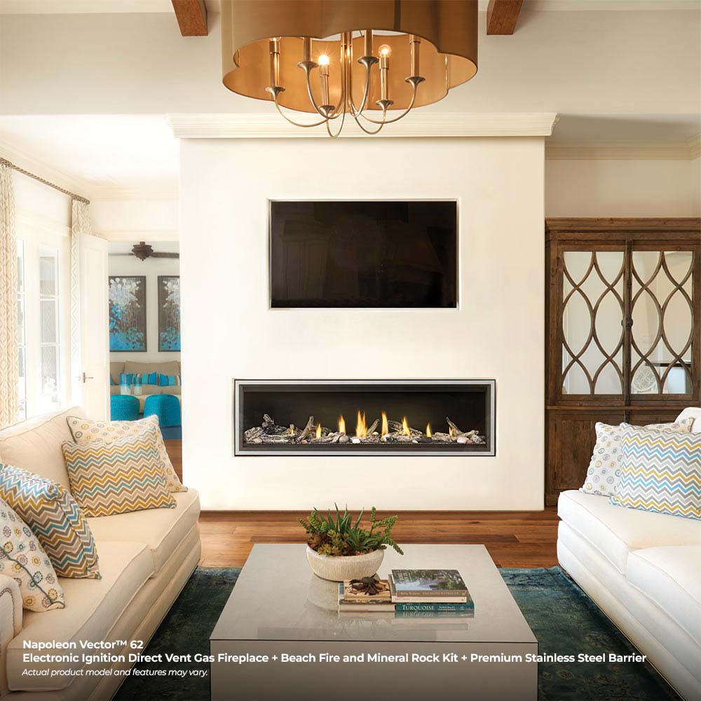 Built-in gas fireplace with burning logs and flames inside a black framed insert