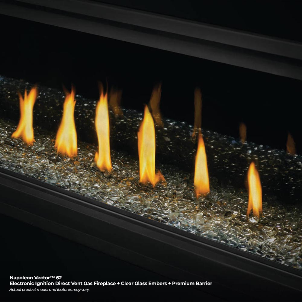 Close-up of gas fireplace flames rising from gray gravel-like decorative media