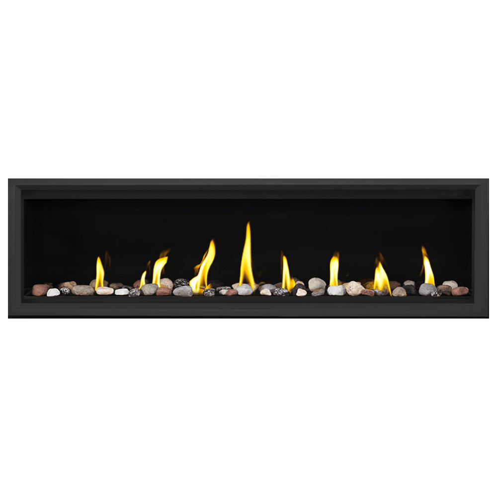 Linear direct vent gas fireplace with flames and mixed decorative media rocks