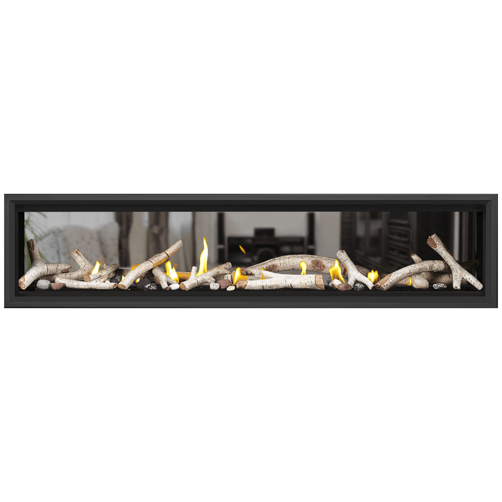 Gas fireplace insert with lit flames, driftwood logs, and light stones in black frame