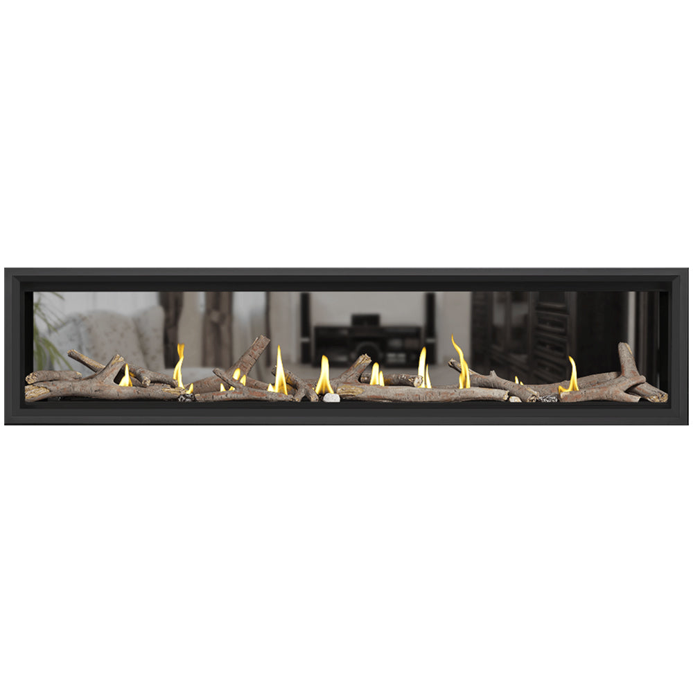 Black-framed direct vent gas fireplace with driftwood and burning flames across the bed