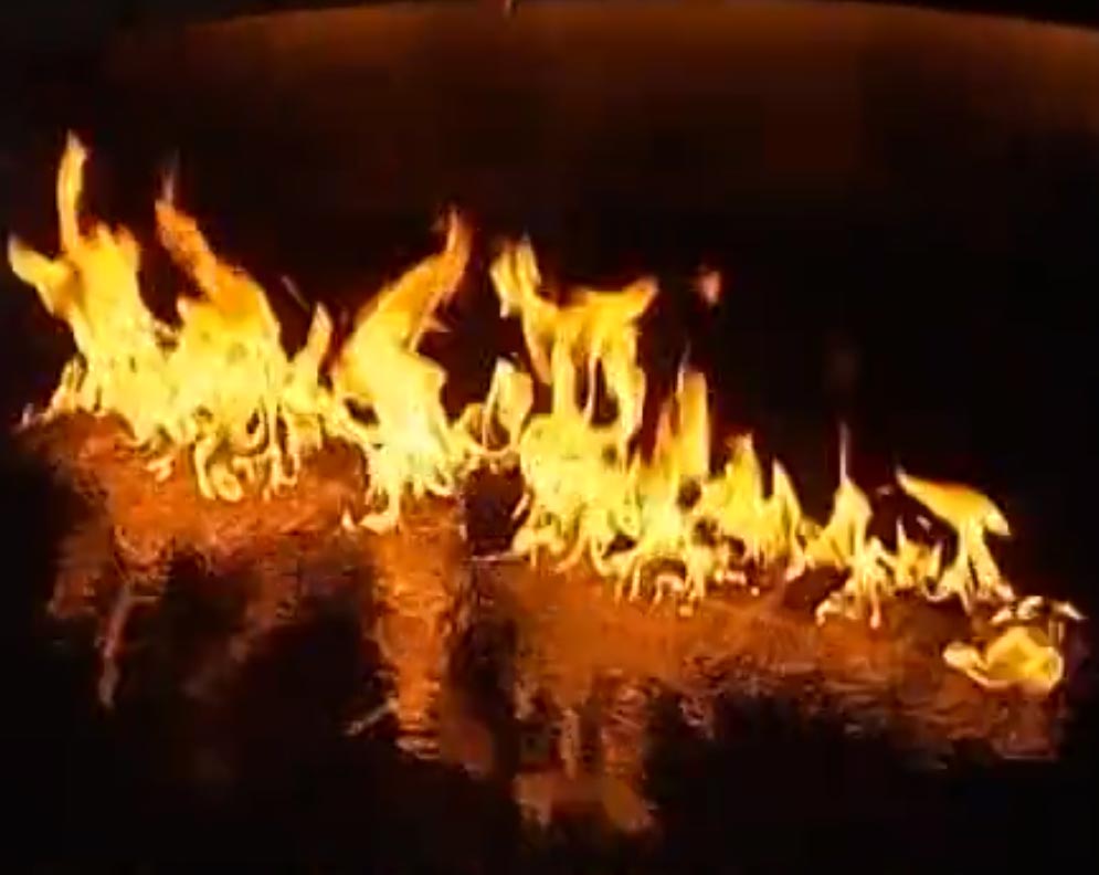 Line of burning gas fire flames with yellow fire jets