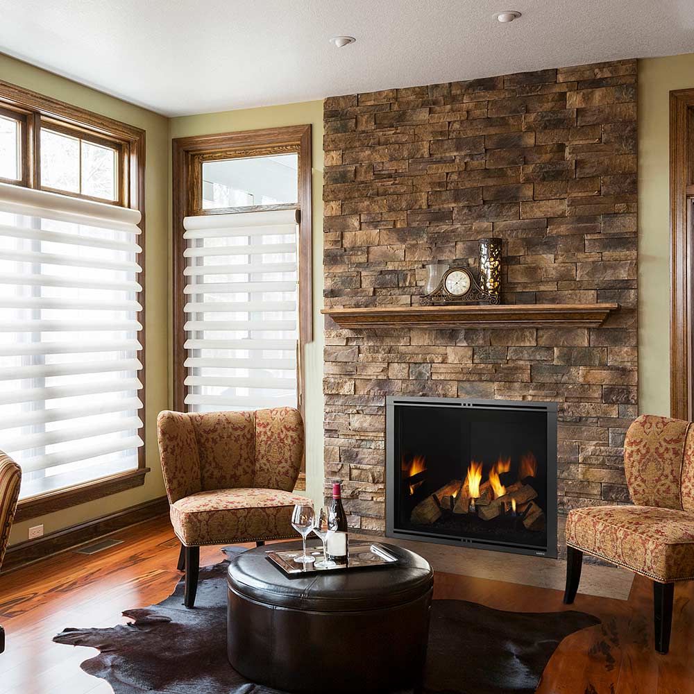 Direct vent gas fireplace with black front panel and visible burning flames
