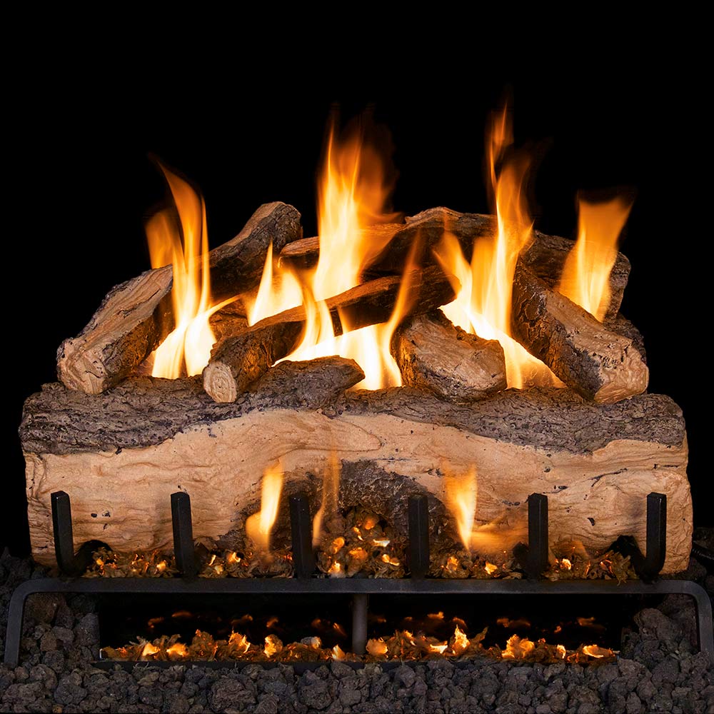 Vented gas log set with split oak logs and glowing flames on metal grate