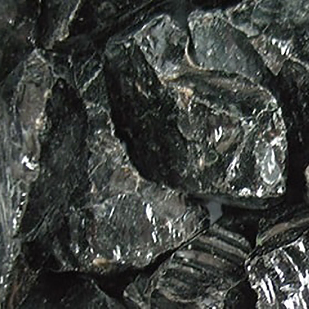Dark glass media chunks with glossy facets for blasting or media cleaning