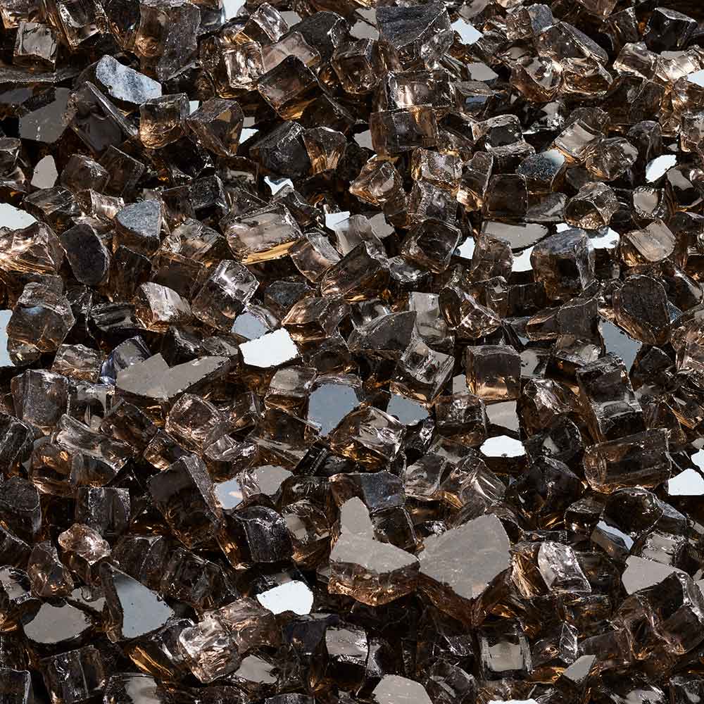 Crushed glass media, dark smoky glass shards with bronze highlights.