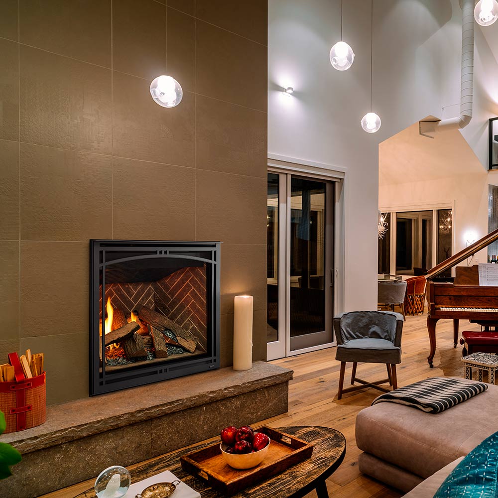Black direct vent gas fireplace insert with flame-lit logs behind clear glass