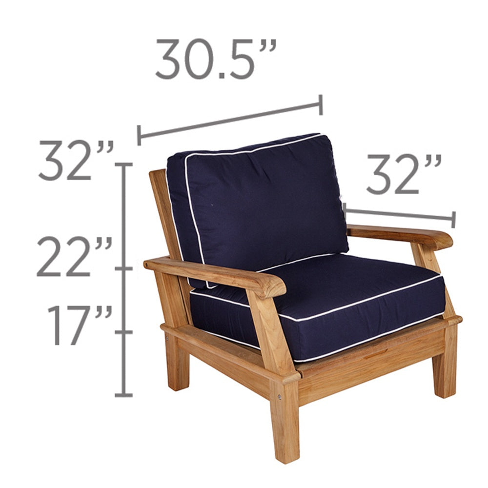 Teak outdoor lounge chair with navy cushion and white piping