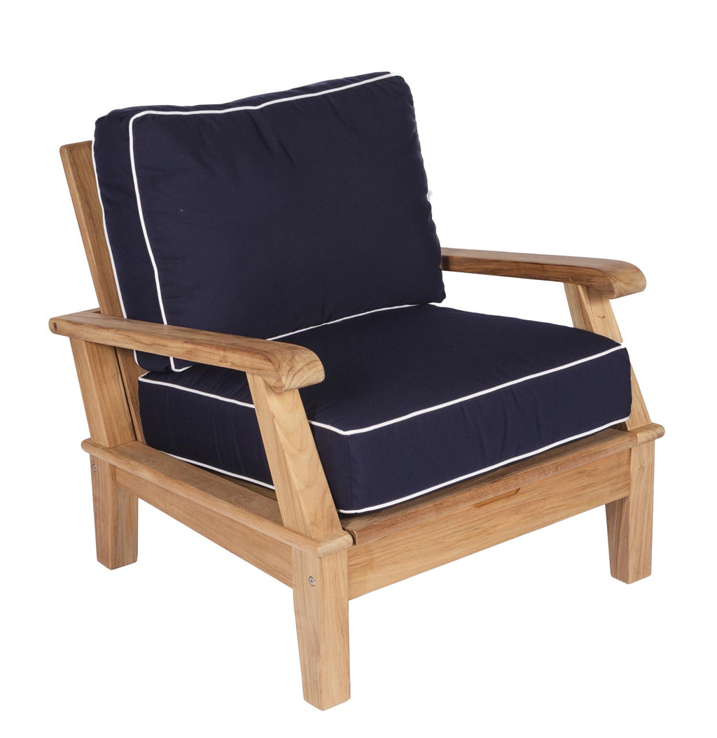Miami chair with navy cushion and natural teak frame, white piping along seams.