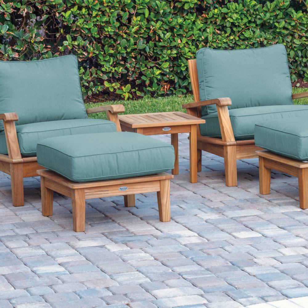 Outdoor teak ottoman with teal canvas seat cushion