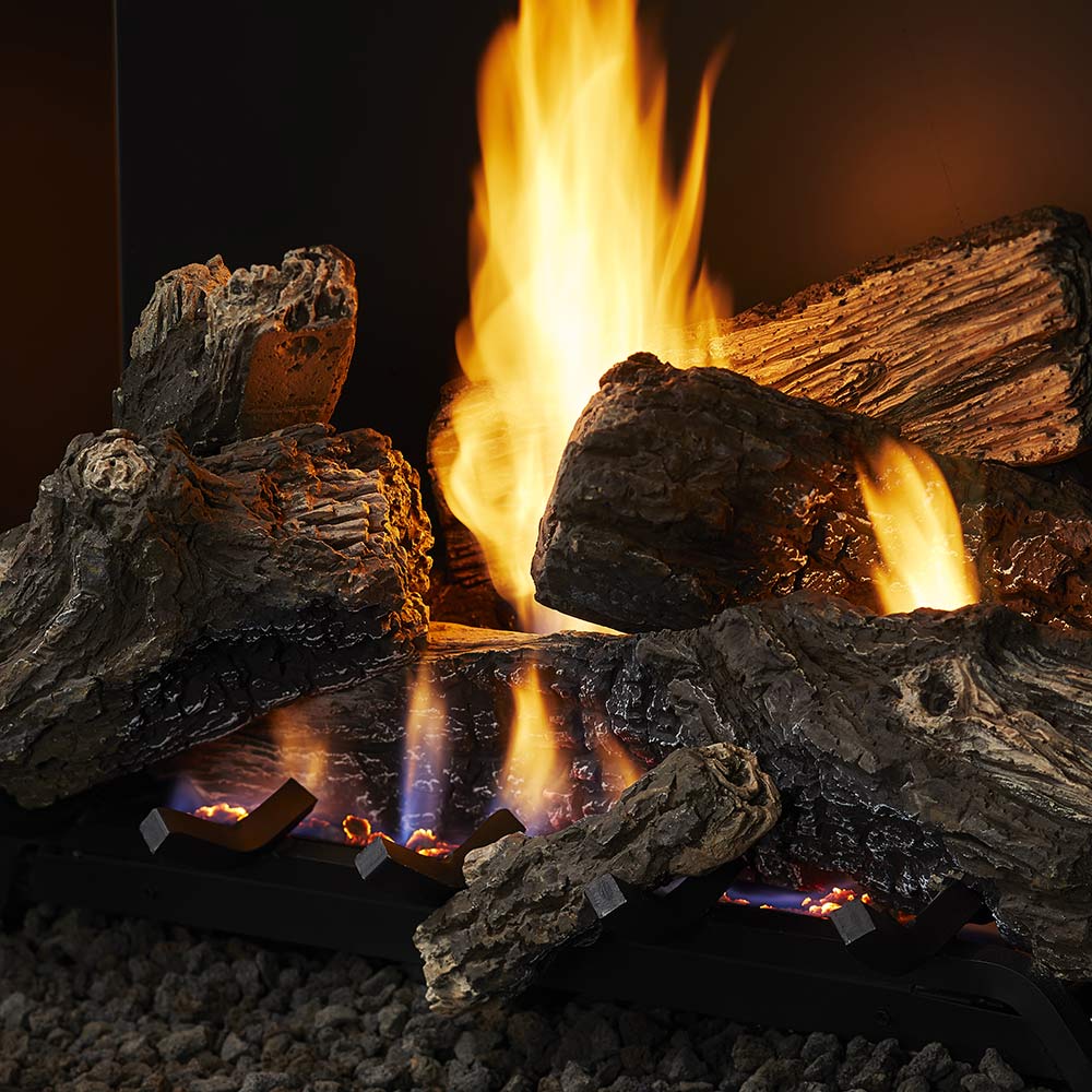 Vent-free gas log set close-up of charred logs with tall flames and glowing coals