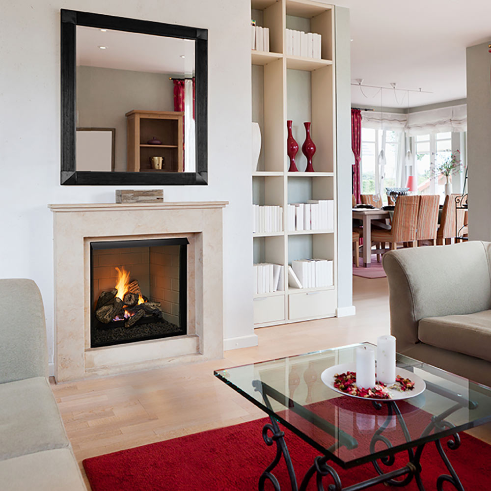 Vent-free gas log fireplace insert with burning logs in a white surround