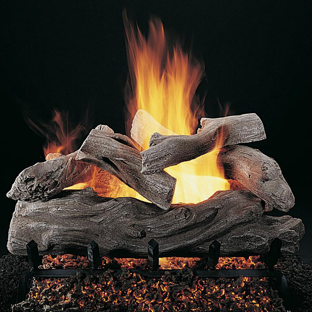 Manzanita gas logs with glowing flames and charred log pieces