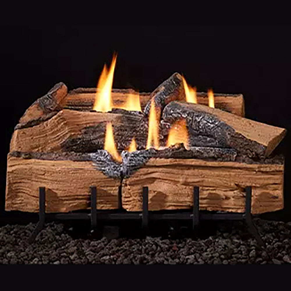Split log set with glowing embers and open flames on a metal grate