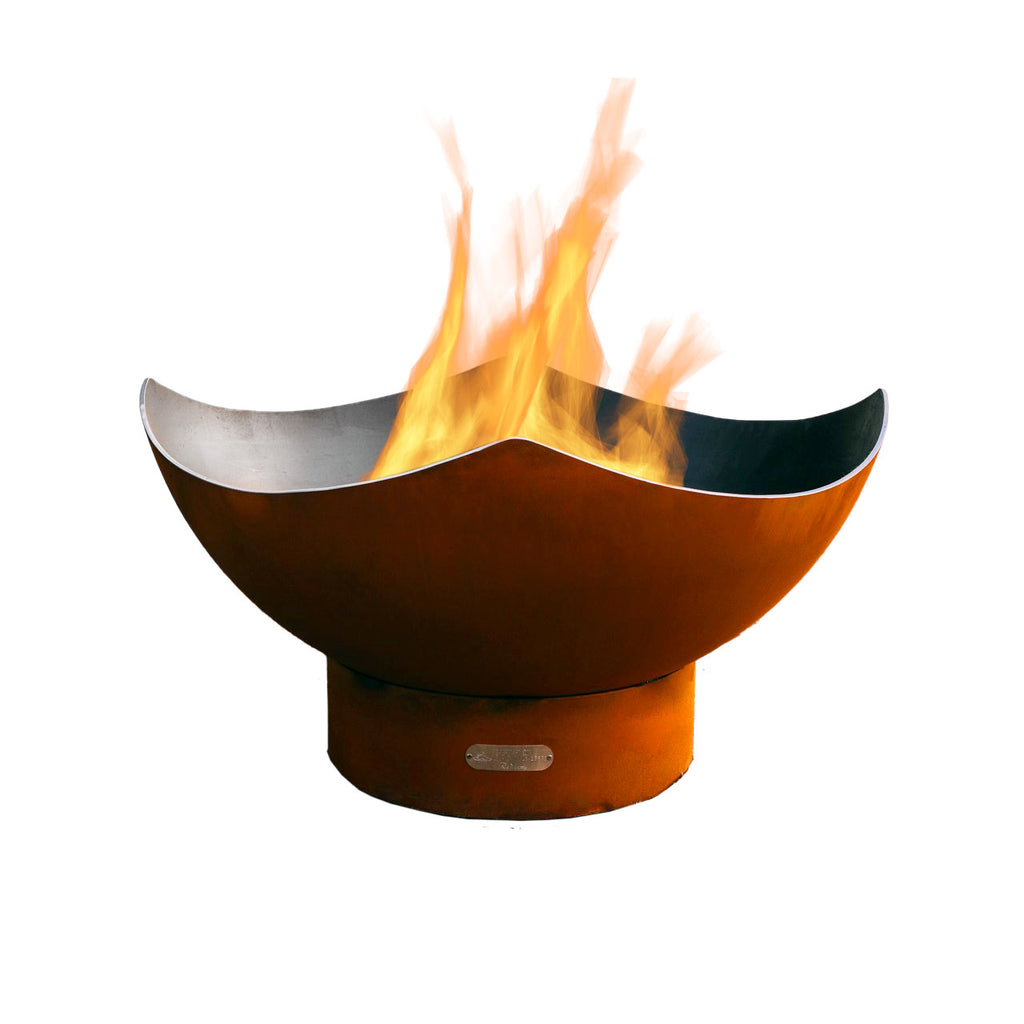 Manta ray gas fire pit in dark bronze with flames rising from the bowl