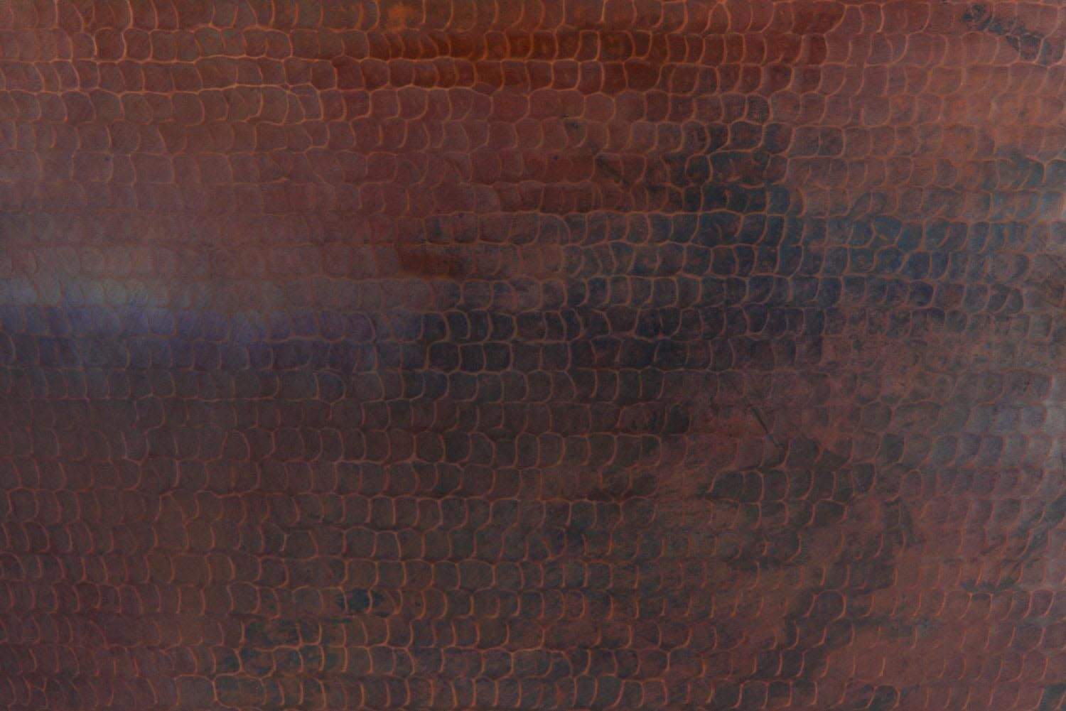 Hammered copper bowl surface with textured finish