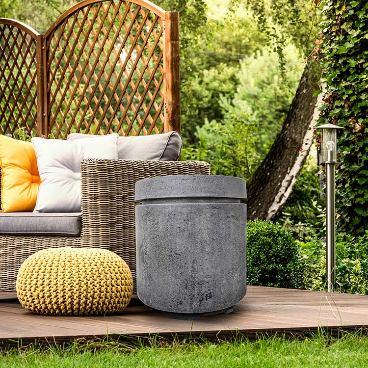 Concrete propane enclosure, dark gray cylinder with lid, patio use shown