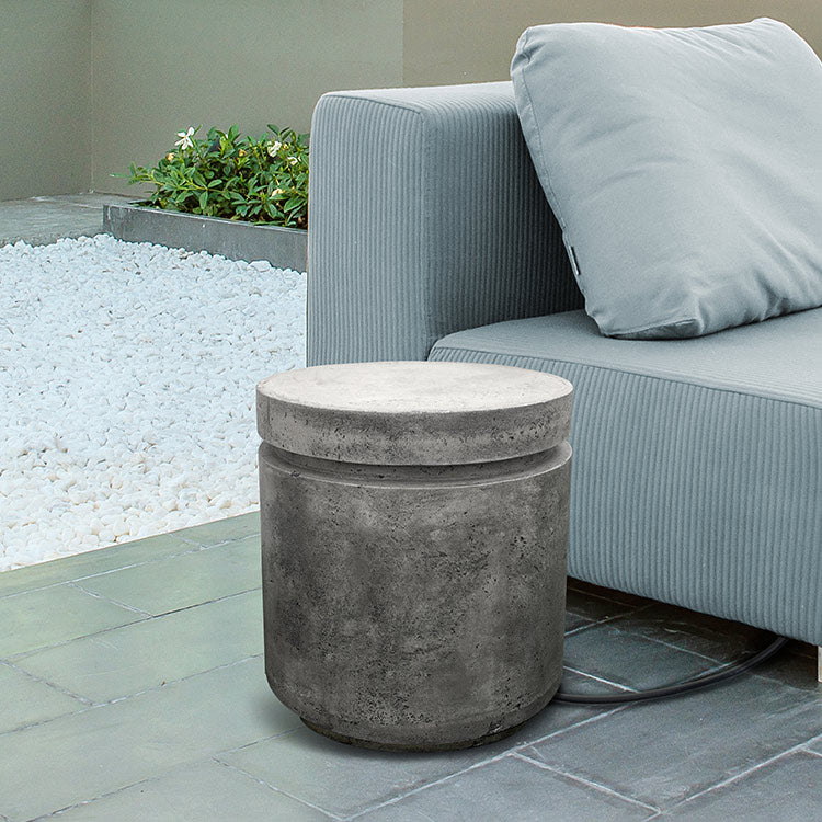 Concrete propane enclosure, dark gray cylinder on patio near outdoor seating