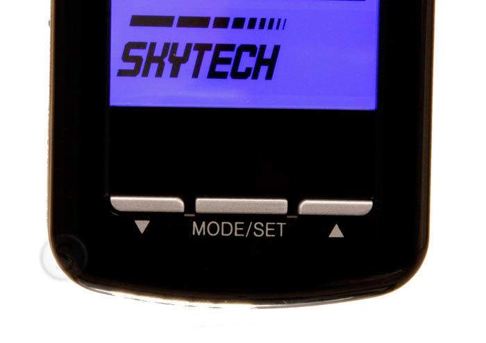 Transmitter remote bottom view with MODE/SET label and arrow buttons under blue LCD
