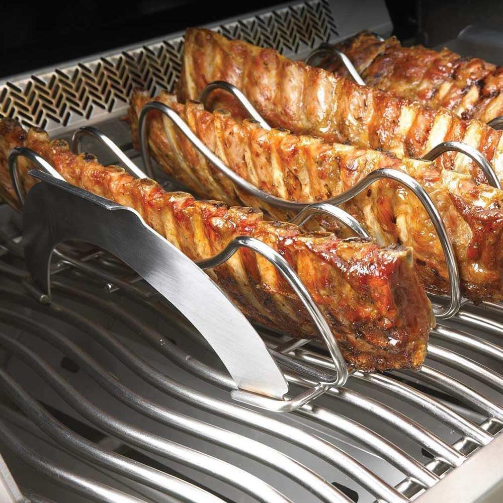 Rib roasting rack with glazed ribs on grill grate