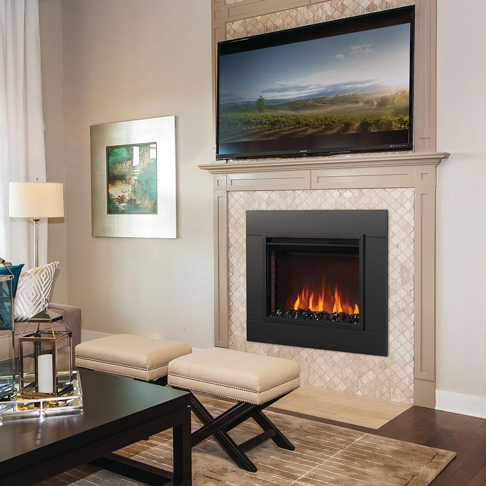 Electric fireplace insert with dark surround, glowing flames, and crystal media logs