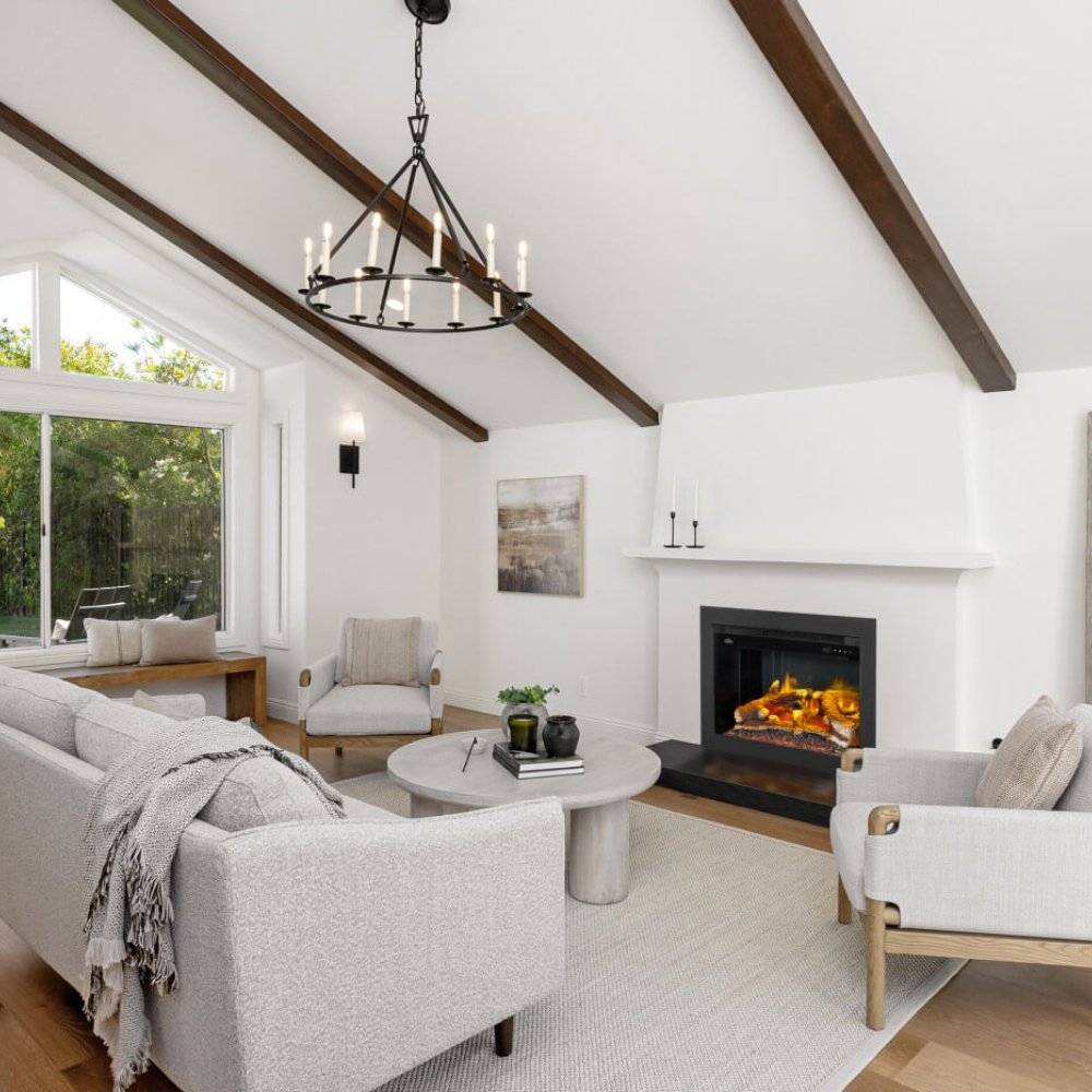 Electric fireplace insert with black frame, burning logs in modern living room