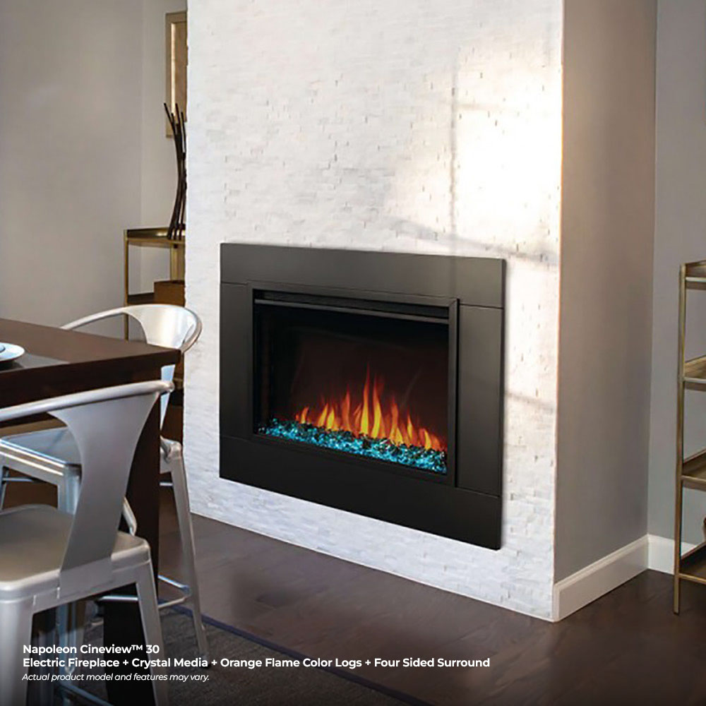 Built-in electric fireplace in a wall with orange flames and blue crystal media base