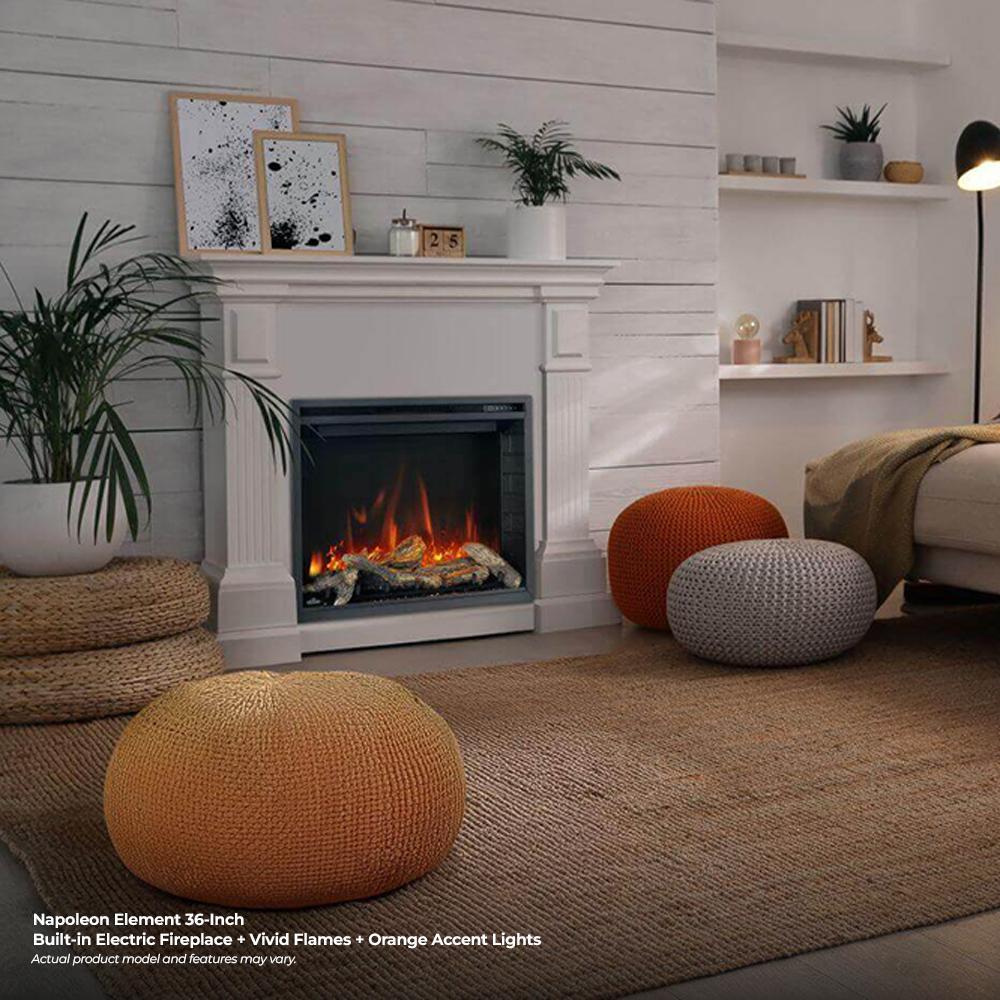 Electric fireplace with white mantel and glass front, showing orange flame effect and logs