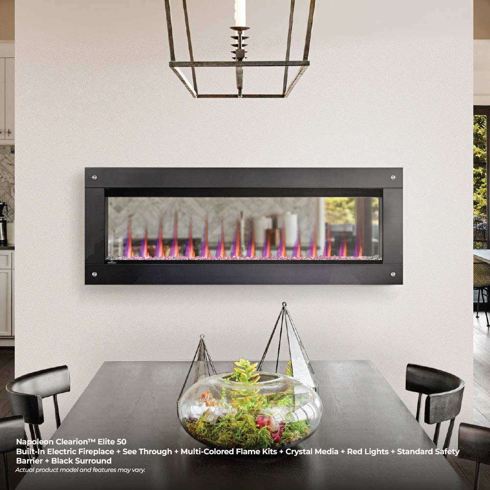Built-in see-through electric fireplace with dark frame, multicolored flames, and clear crystal bed