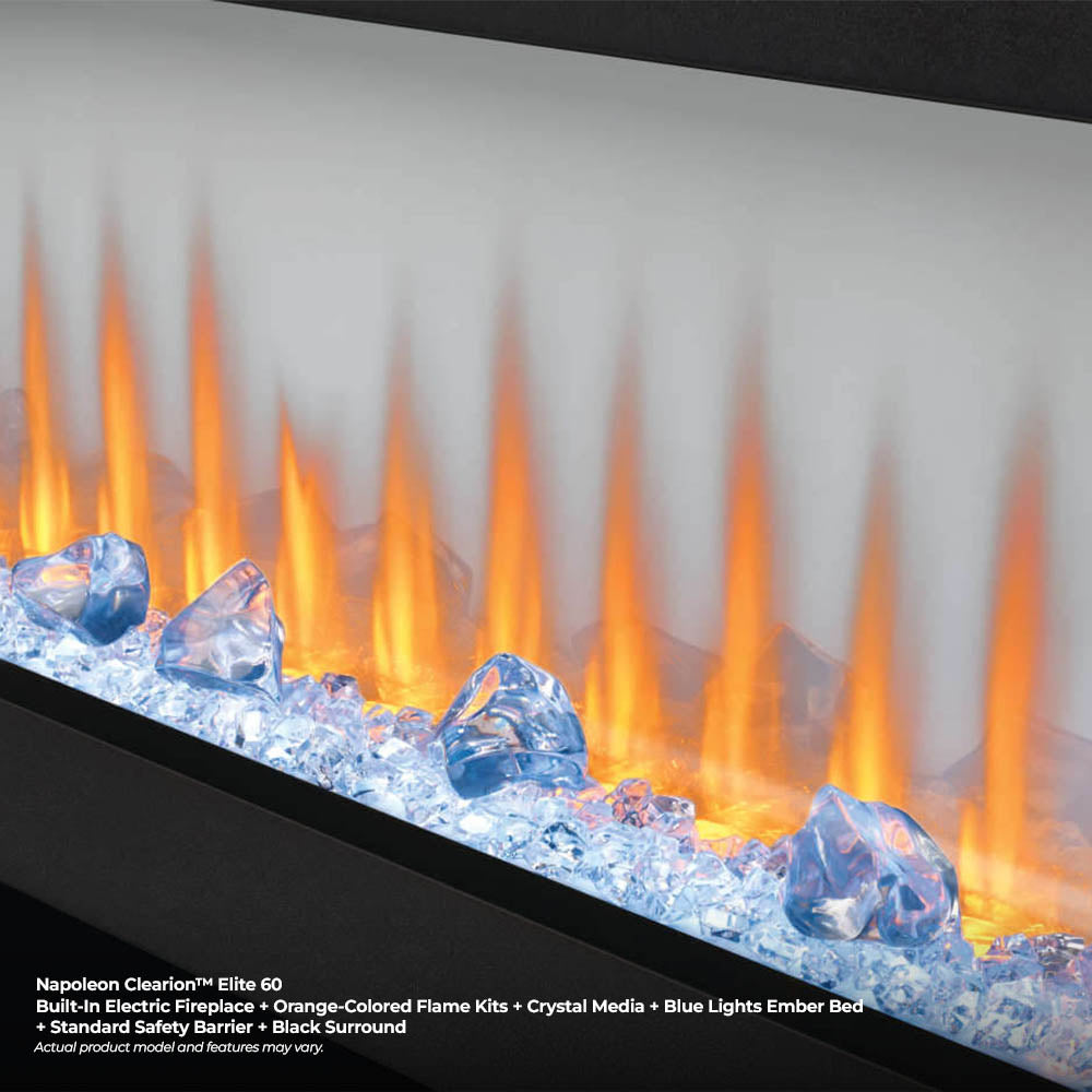 Electric fireplace close-up of orange flames over blue crystal media behind glass