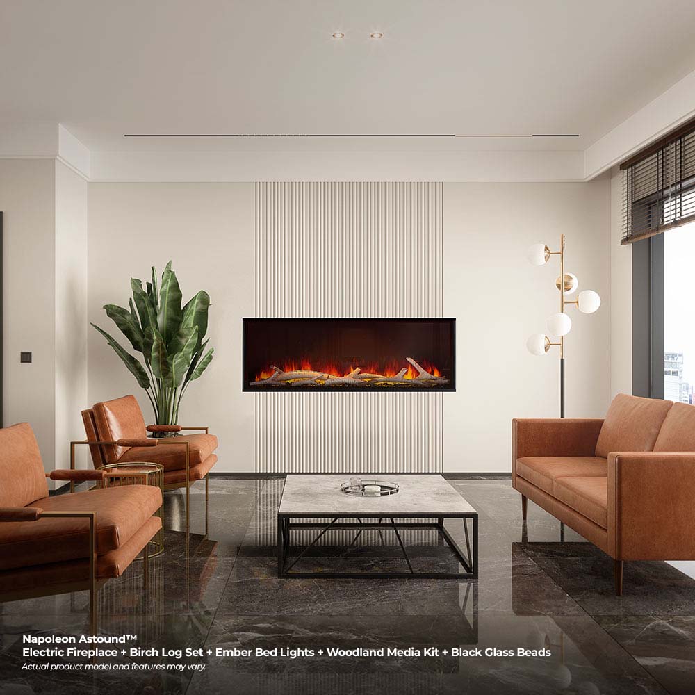 Built-in electric fireplace with black trim and glowing fire logs