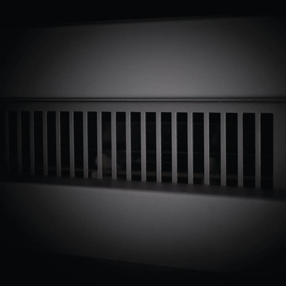 Electric fireplace air vent grille with vertical slats at the top of the firebox