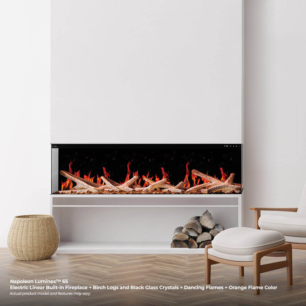 Built-in linear electric fireplace insert with orange flame effect over logs and embers