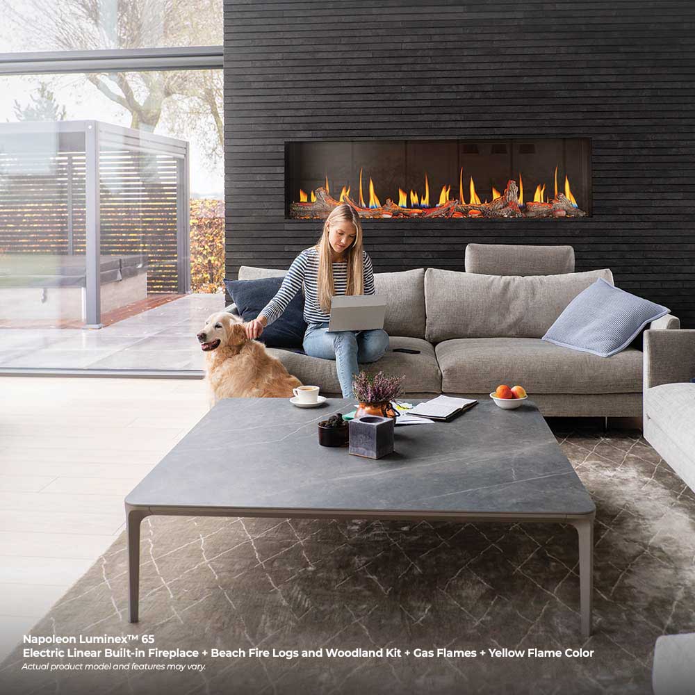 Built-in linear electric fireplace with orange flame effect in a wall recess