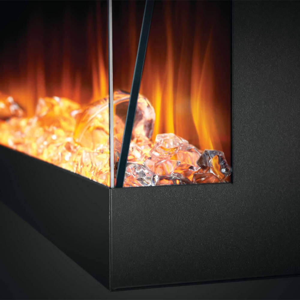 Close-up of electric fireplace flame and ember bed behind black glass panel